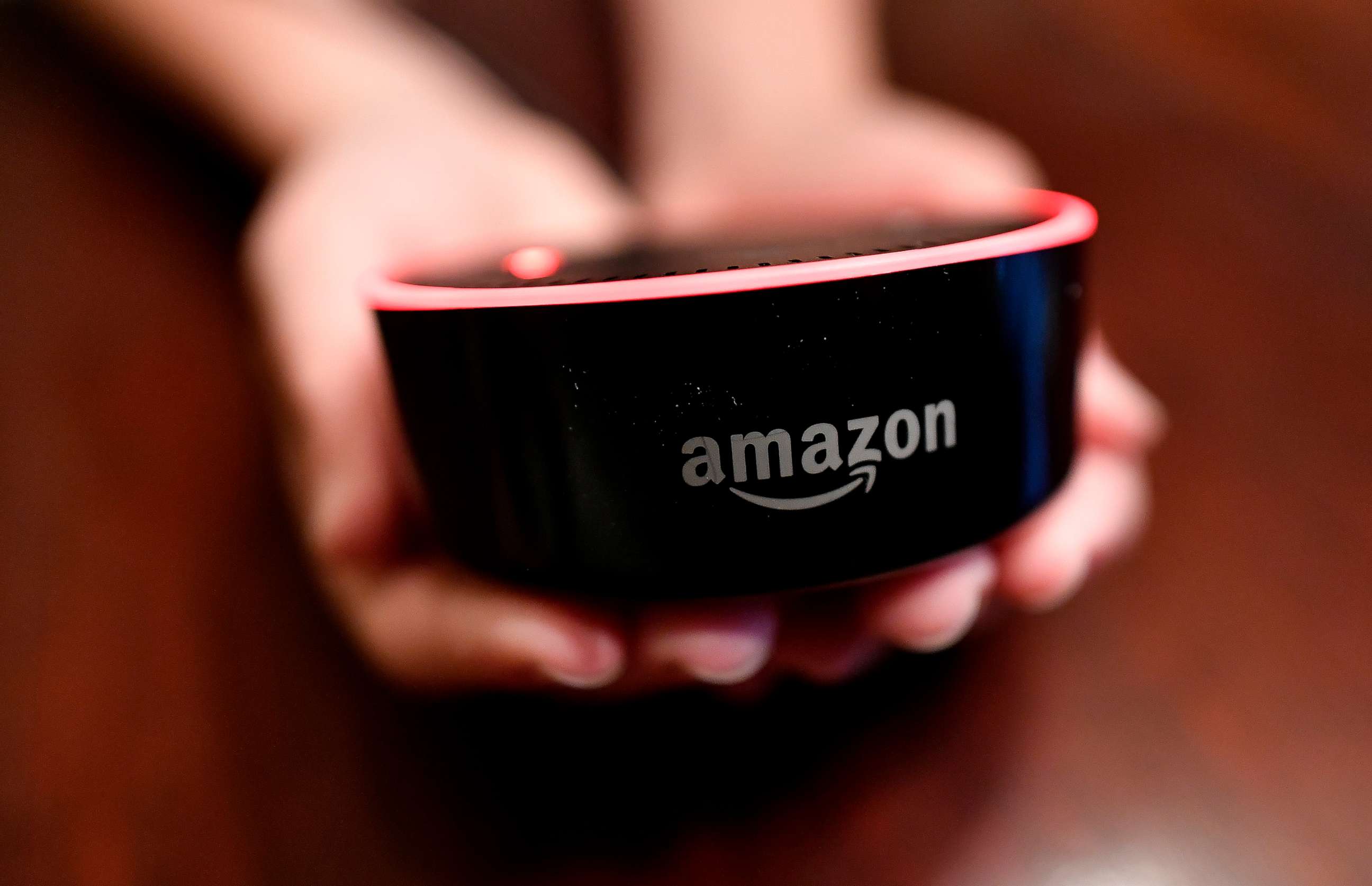 PHOTO: In this file photo, a child holds his Amazon Echo Dot in Kennesaw, Ga., Aug. 16, 2018.