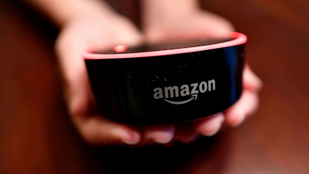 PHOTO: In this file photo, a child holds his Amazon Echo Dot in Kennesaw, Ga., Aug. 16, 2018.