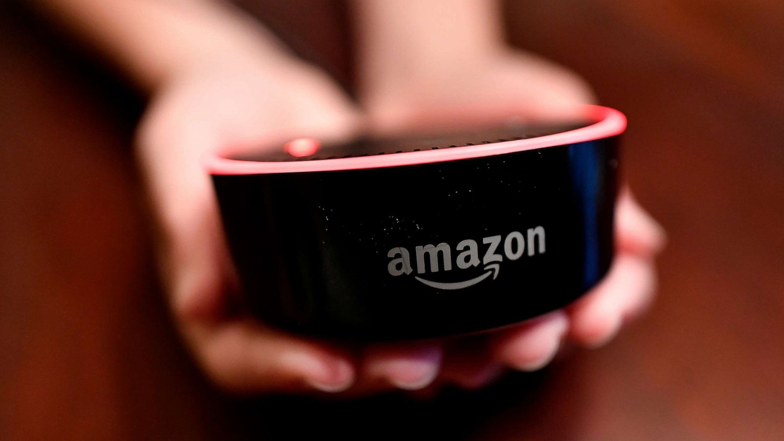 PHOTO: In this file photo, a child holds his Amazon Echo Dot in Kennesaw, Ga., Aug. 16, 2018.