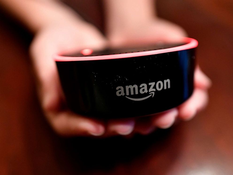 PHOTO: A child holds his Amazon Echo Dot in Kennesaw, Ga., Aug. 16, 2018.