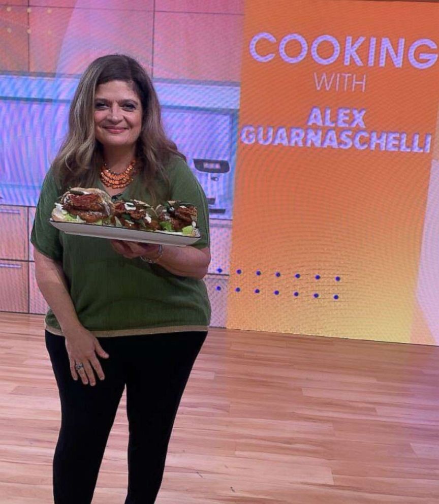 PHOTO: Chef Alex Guarnaschelli holds a platter of chicken cutlet sandwiches.