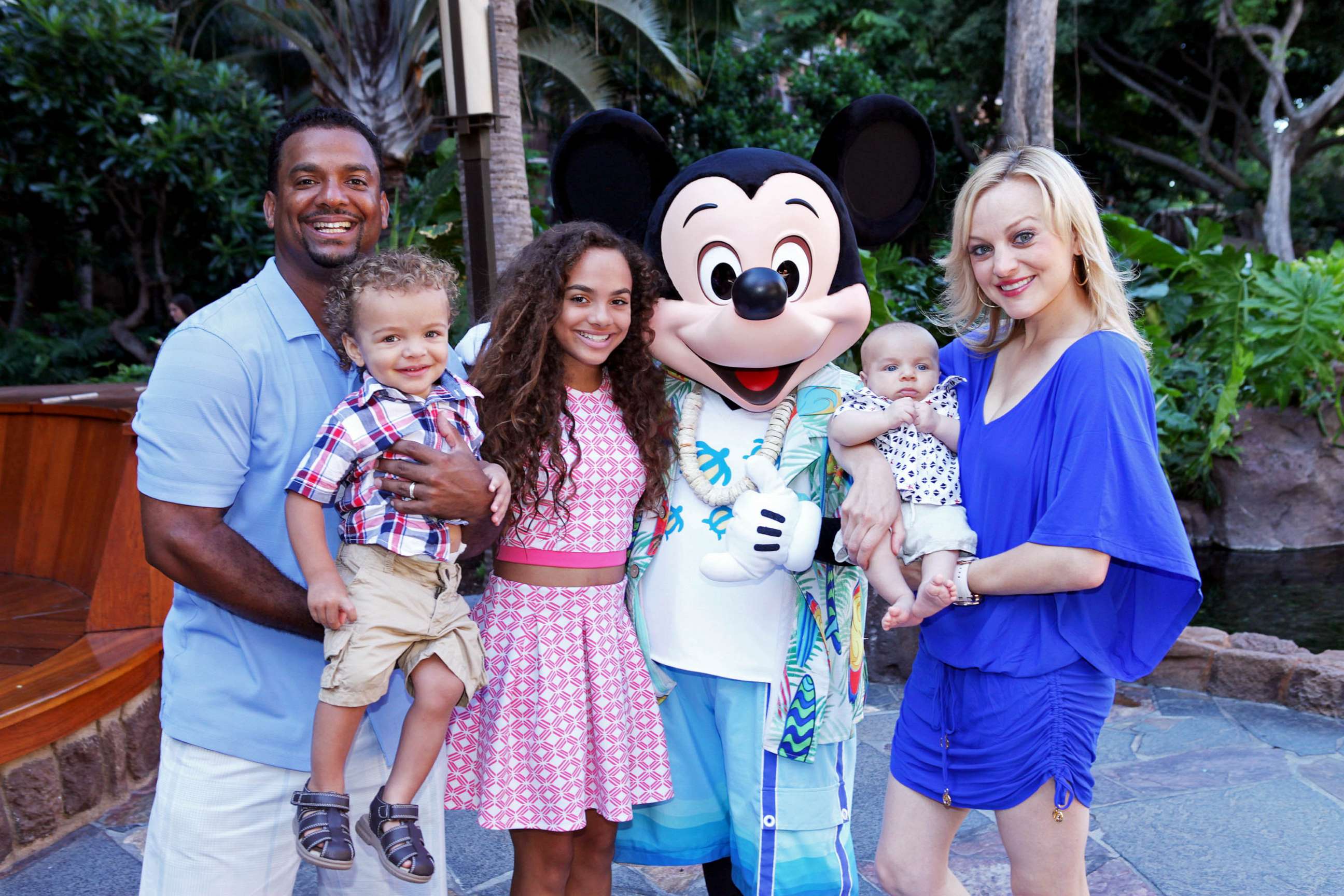 PHOTO: FILE - Actor and television host Alfonso Ribeiro and his family, Alfonso Jr., 2, Sienna, 12, Anders, 3 months, and wife Angela, meet Mickey Mouse at Aulani, a Disney Resort & Spa, July 26, 2015 on the island of Oahu in Hawaii.