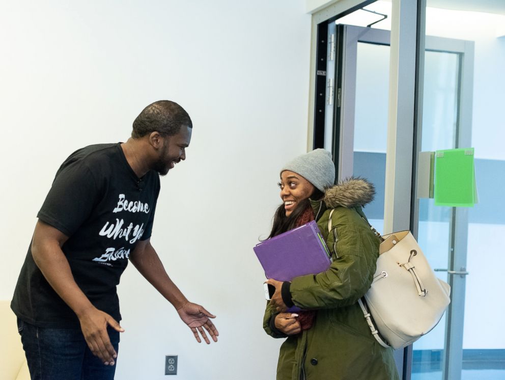 PHOTO: Howard University senior Mya Thompson learns from Rev. Marc Lavarin that Alfred Street Baptist Church is paying her student debt.