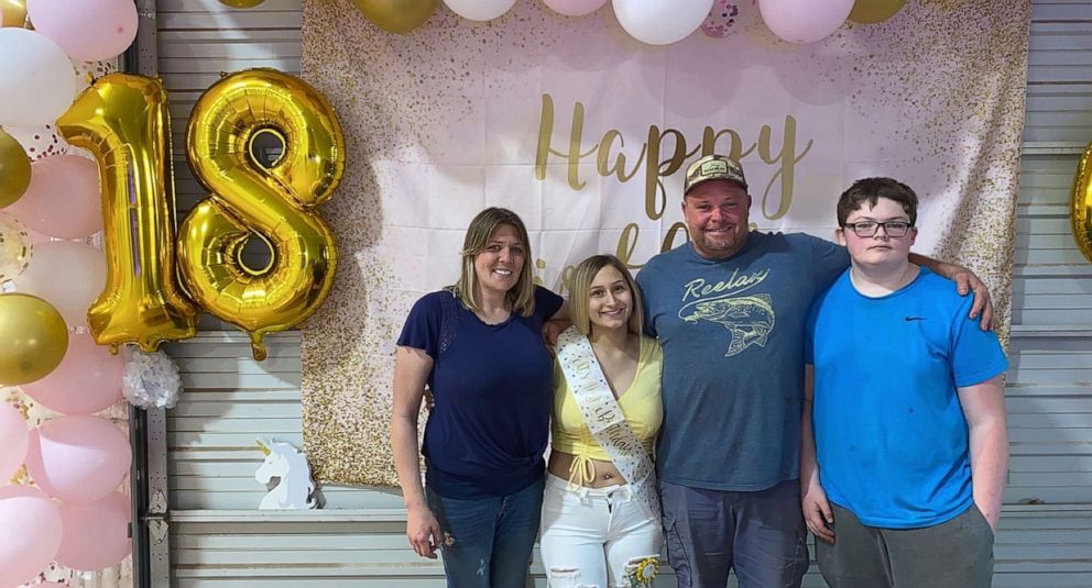 PHOTO: Alize Martinez with her godparents at her 18th birthday party.