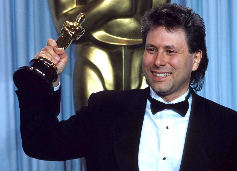 PHOTO: Alan Menken holds the Oscar he received for Best Original Score in "The Little Mermaid" during the 62nd Academy Awards ceremony Mar. 26, 1990, in Los Angeles.