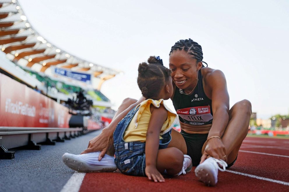 PHOTO: Allyson Felix celebrates with her daughter Camryn after finishing second in the Women's 400 Meters Final on day three of the 2020 U.S. Olympic Track &amp; Field Team Trials at Hayward Field, June 20, 2021, in Eugene, Ore.