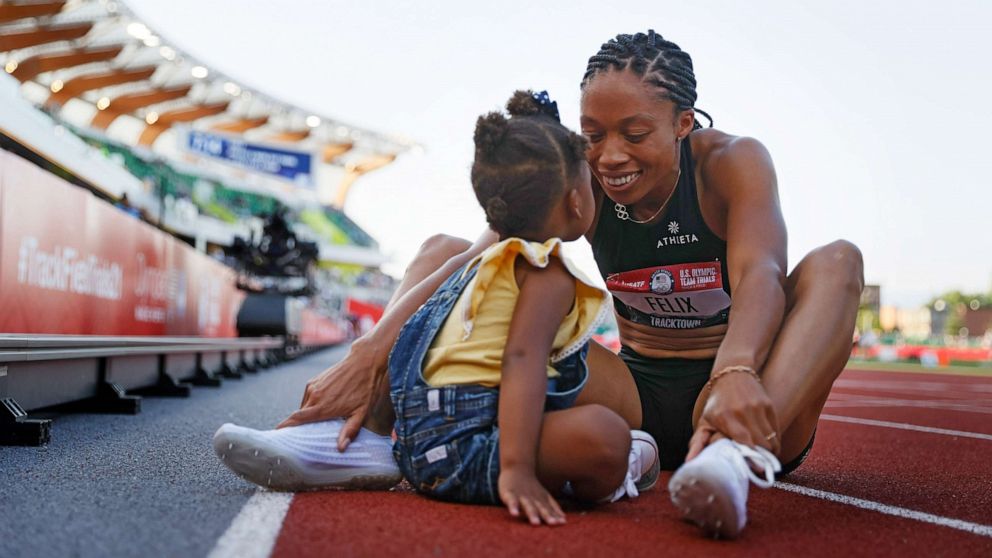 PHOTO: Allyson Felix celebrates with her daughter Camryn after finishing second in the Women's 400 Meters Final on day three of the 2020 U.S. Olympic Track & Field Team Trials at Hayward Field, June 20, 2021, in Eugene, Ore.