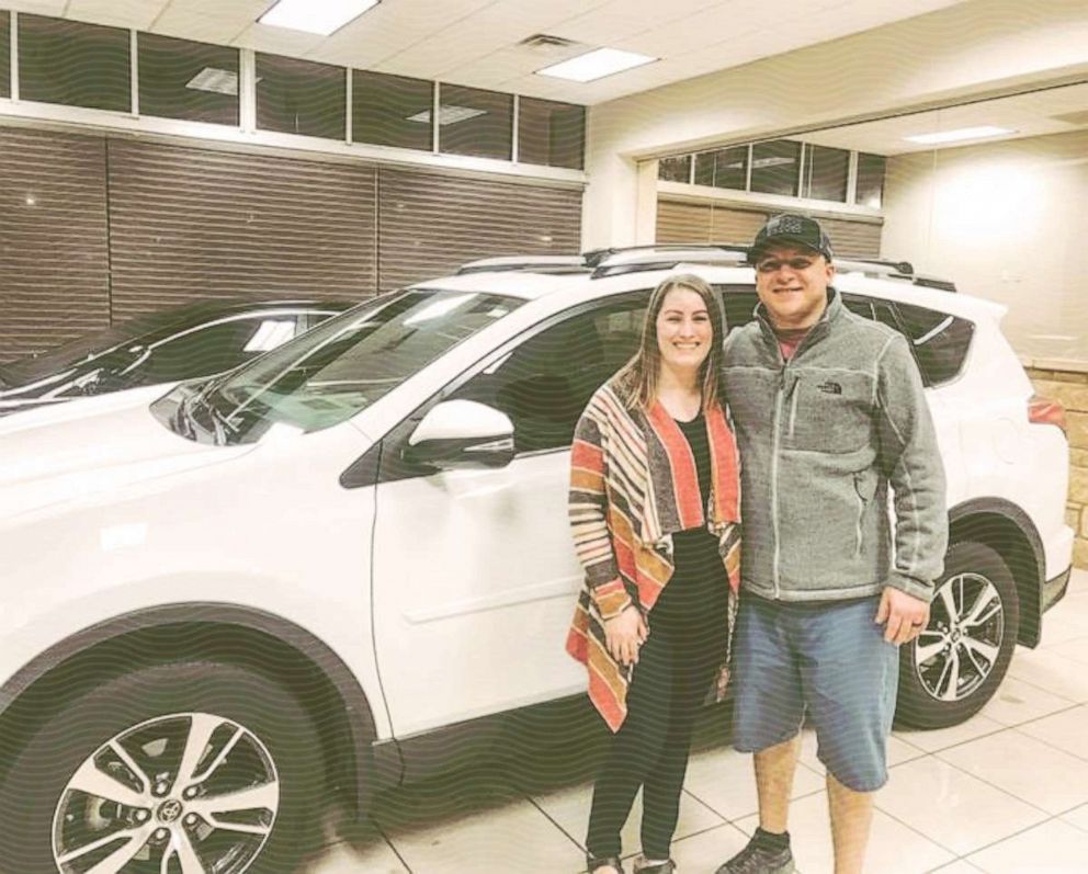 Amanda and Josh Williams celebrate the purchase of their new-to-them vehicle in 2019.