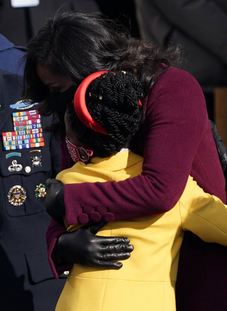 PHOTO: Former First Lady Michelle Obama embraces Amanda Gorman during the inauguration of Joe Biden as the 46th President of the United States on the West Front of the U.S. Capitol in Washington, D.C., Jan. 20, 2021.