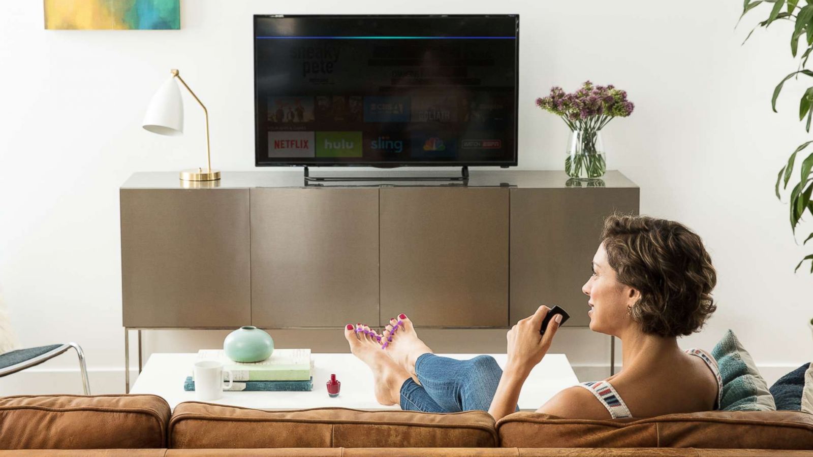 PHOTO: A woman uses an Amazon Fire TV in an undated marketing image from Amazon.