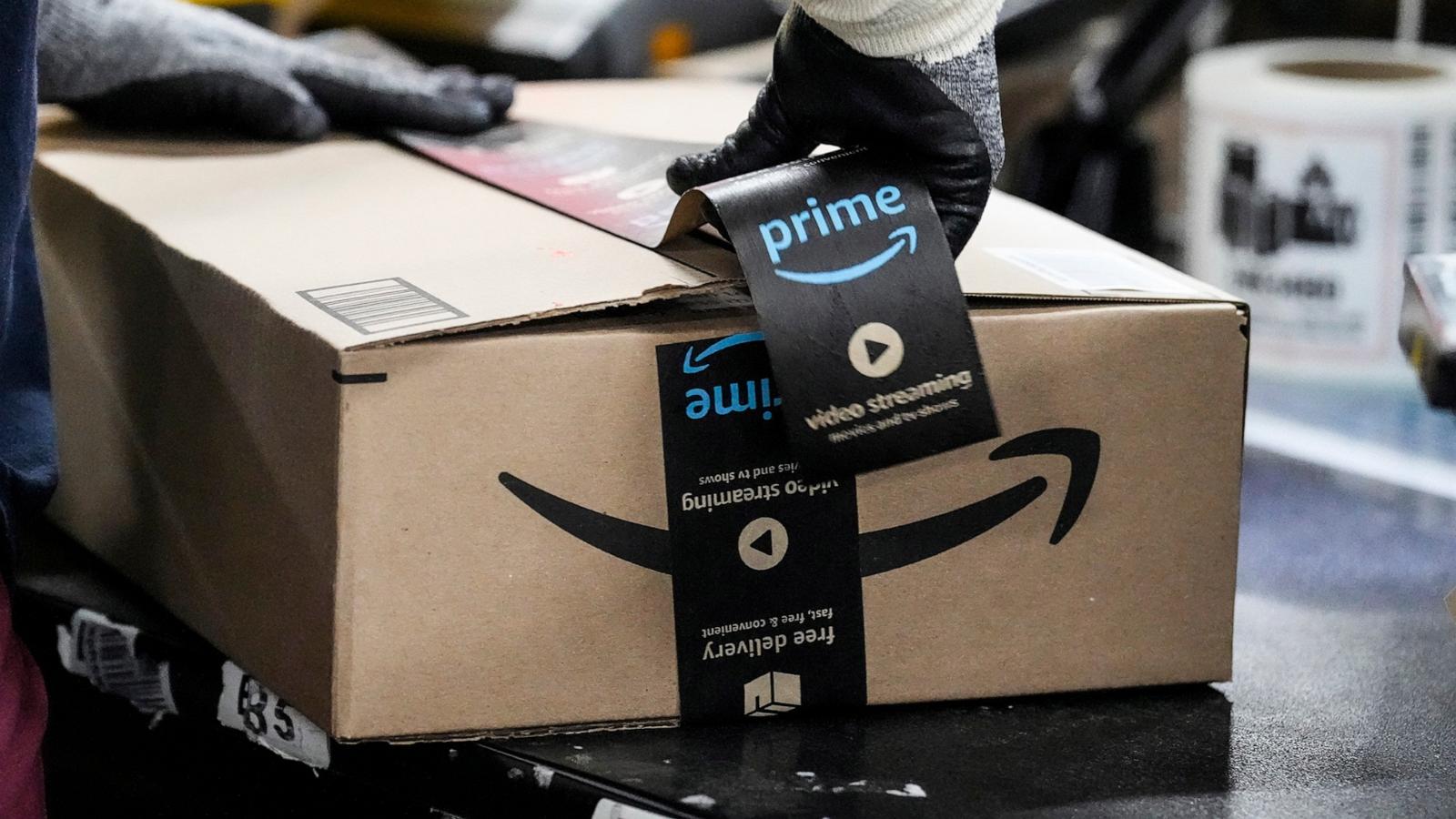 PHOTO: A wrker tapes up a box preparing an item to be shipped at the Amazon HOU6 Fulfillment Center, Nov. 27, 2023, in Richmond, Texas,