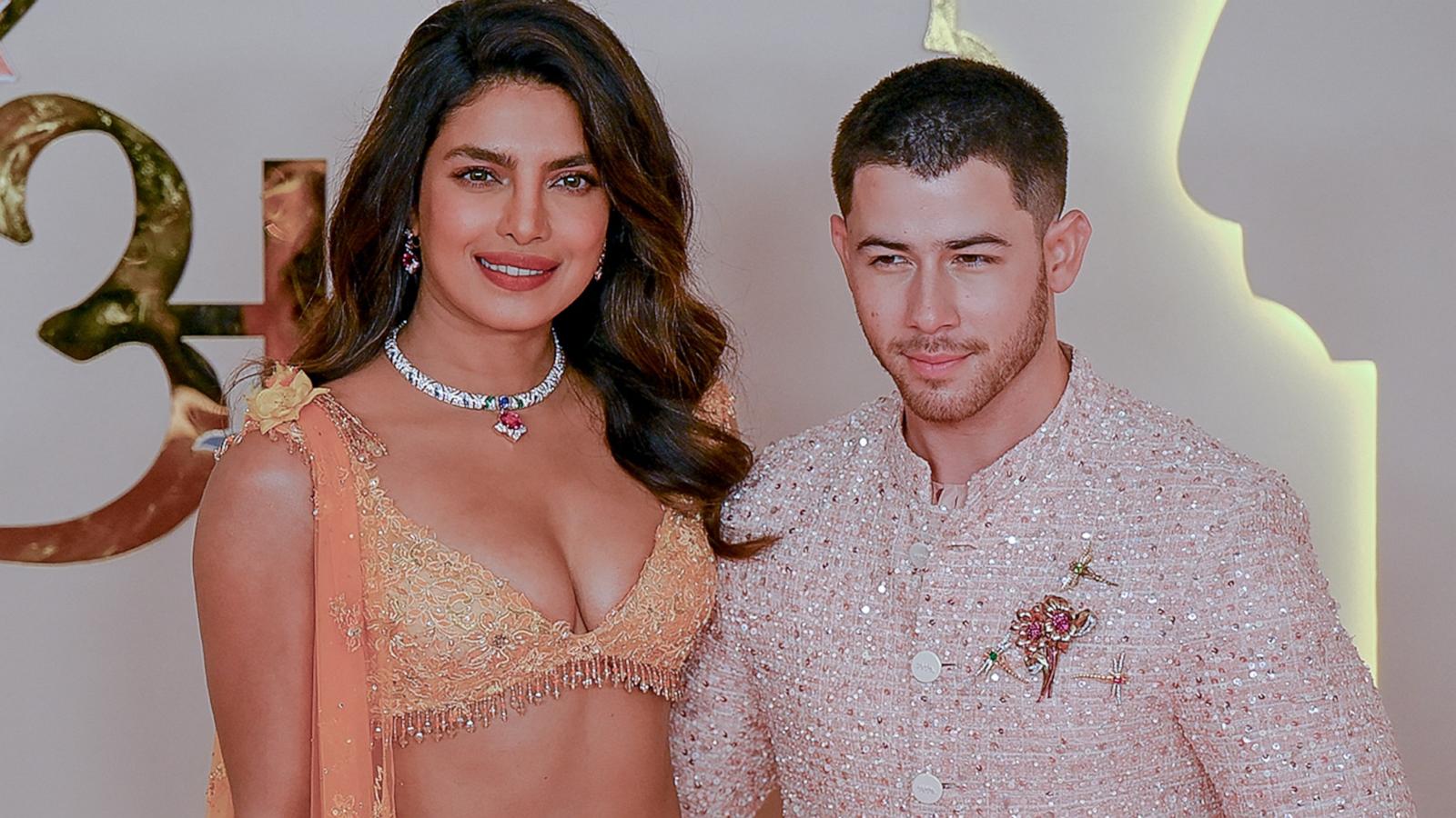 PHOTO: Priyanka Chopra Jonas and Nick Jonas pose for photos as they arrive at the wedding ceremony of billionaire tycoon and Chairman of Reliance Industries Mukesh Ambani's son Anant Ambani and Radhika Merchant, July 12, 2024, in Mumbai, India.