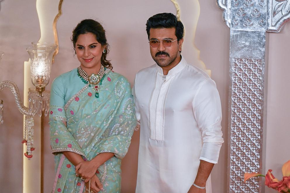 PHOTO: Actor Ram Charan and wife Upasana Kamineni pose for photos as they arrive at the wedding ceremony of billionaire tycoon and Chairman of Reliance Industries Mukesh Ambani's son Anant Ambani and Radhika Merchant, July 12, 2024, in Mumbai, India. 