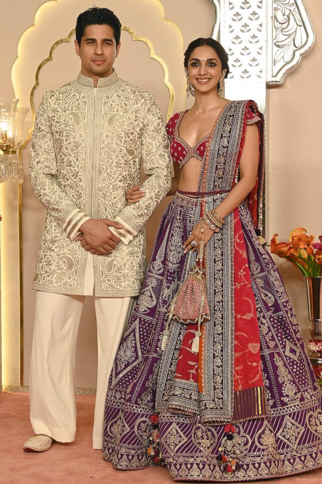 PHOTO: Bollywood actors Sidharth Malhotra and his wife Kiara Advani pose for photos as they arrive at the wedding ceremony of Anant Ambani and Radhika Merchant, July 12, 2024, in Mumbai, India. 