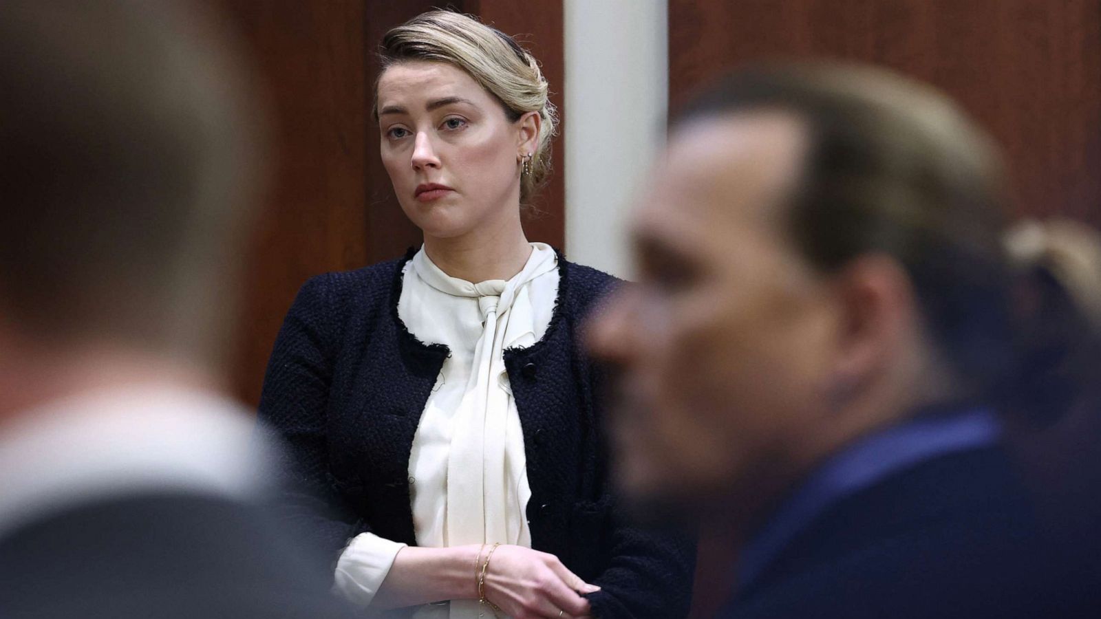 PHOTO: Actor Amber Heard and her ex-husband, actor Johnny Depp, return to the courtroom following a break during a defamation case against her by Depp, at Fairfax County Circuit Court, in Fairfax, Va., May 5, 2022.