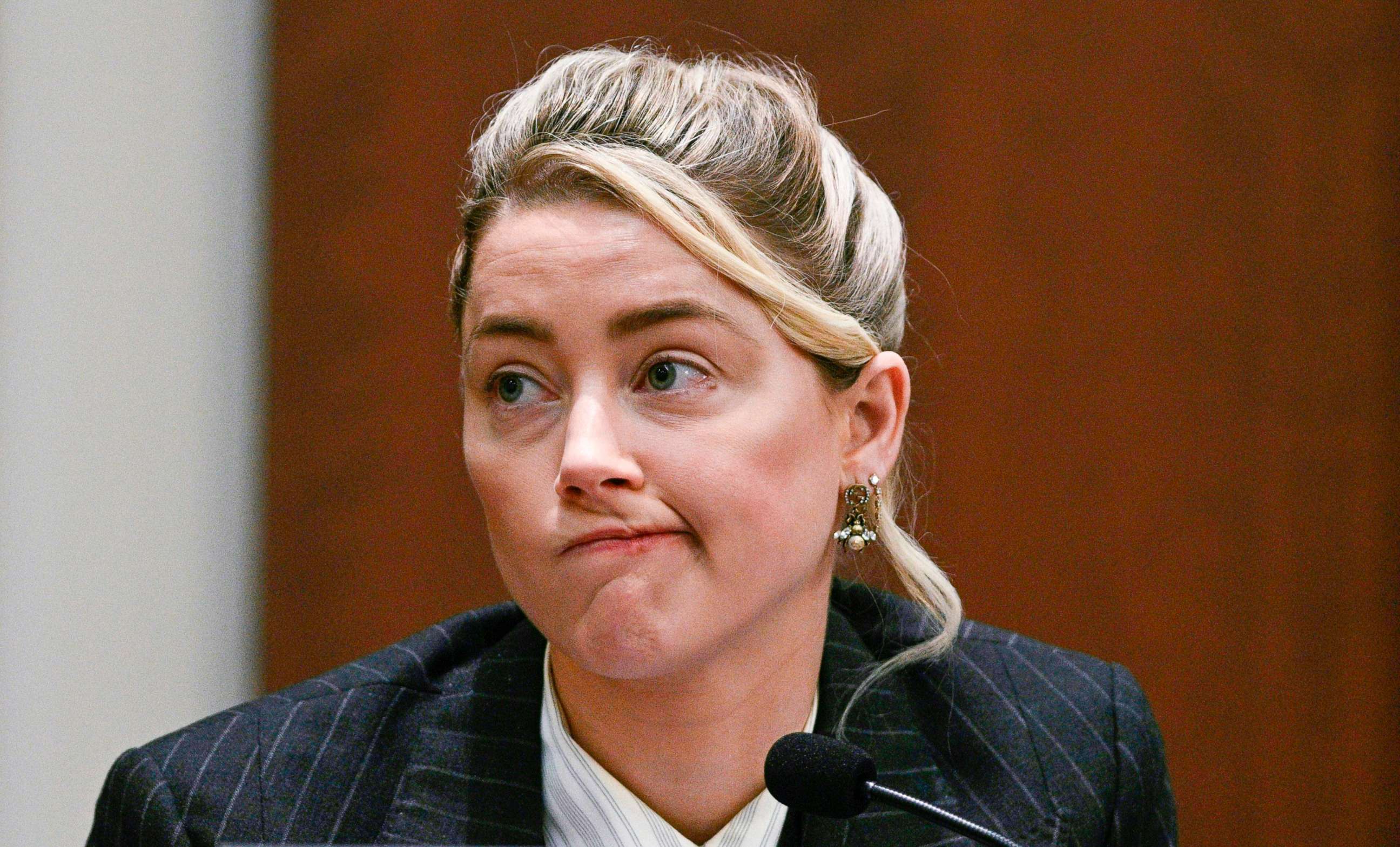 PHOTO: Actor Amber Heard testifies in the courtroom at the Fairfax County Circuit Courthouse in Fairfax, Va., Tuesday, May 17, 2022.