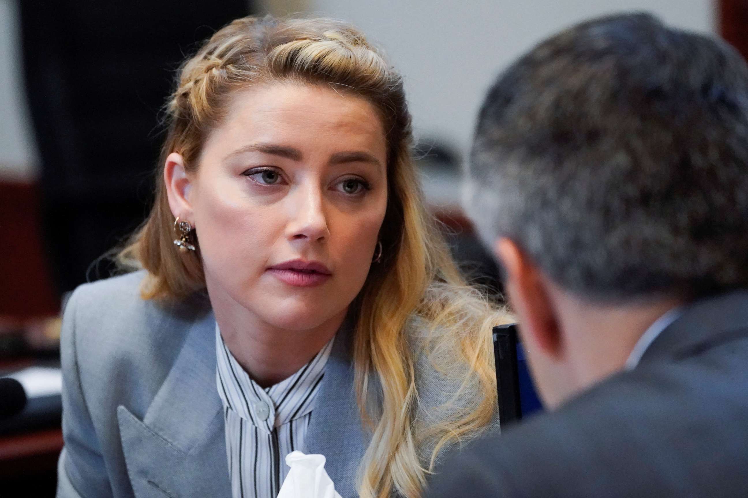 PHOTO: Actor Amber Heard talks with her legal team in the courtroom during ex-husband Johnny Depp's defamation case against her at the Fairfax County Circuit Courthouse in Fairfax, Va., May 27, 2022.