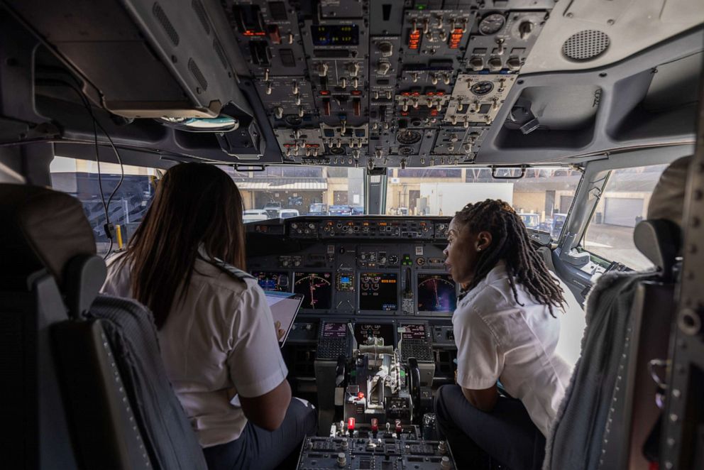 PHOTO: Pilots that were part of an All-Black female crew that helped operate an American Airlines flight from Dallas to Phoenix paying tribute to trailblazer Bessie Coleman, who was the first Black woman to earn a pilot's license in 1921.