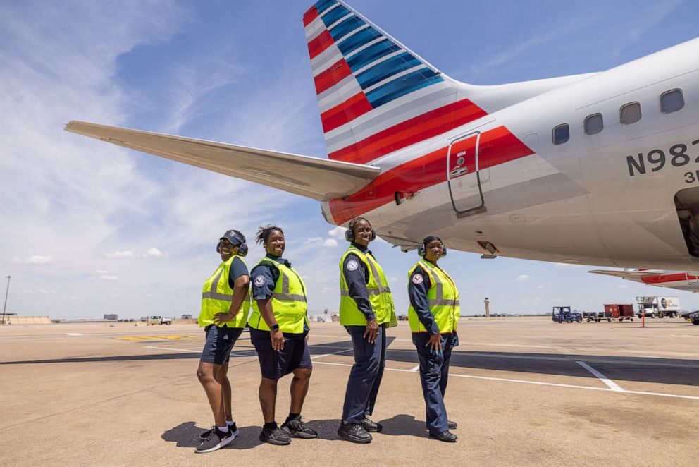 PHOTO: Ground crew that were part of an All-Black female crew that helped operate an American Airlines flight from Dallas to Phoenix paying tribute to trailblazer Bessie Coleman, who was the first Black woman to earn a pilot's license in 1921.