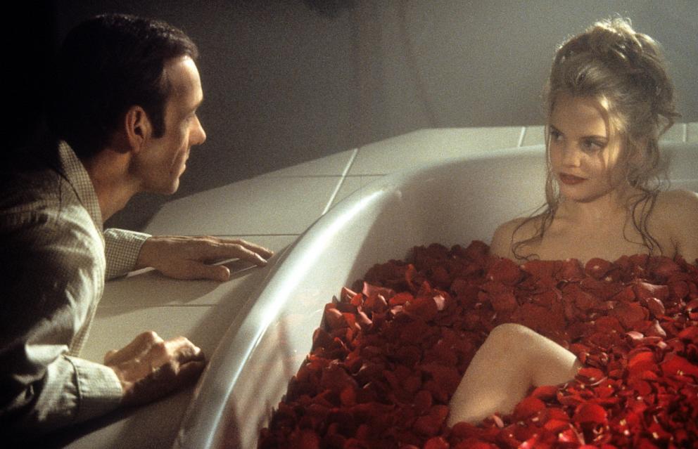 PHOTO: Kevin Spacey looks at Mena Suvari as she bathes in rose pedals in a scene from the 1999 film "American Beauty."