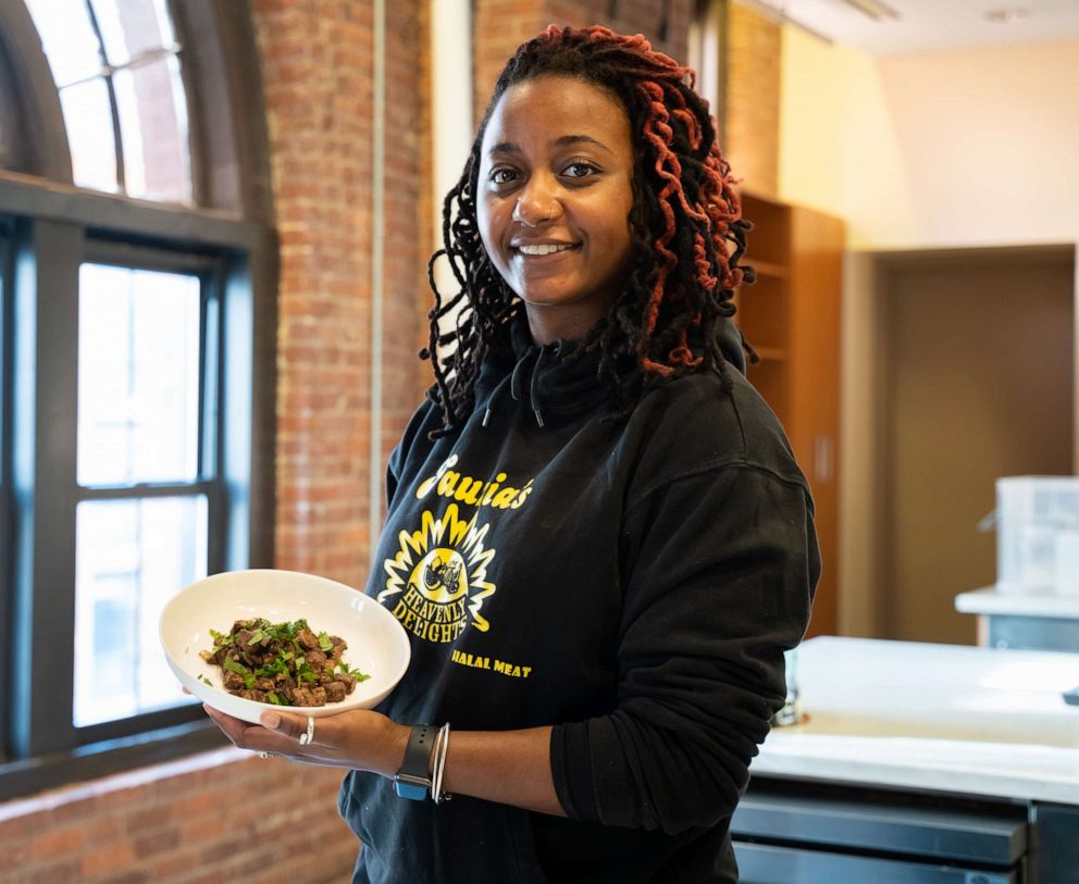 PHOTO: Fauzia Aminah Rasheed, the second-generation owner of Fauzia's with a bowl of their famous Jamaican jerk tofu.