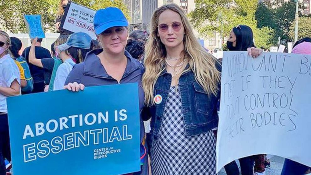 PHOTO: Amy Schumer and Jennifer Lawrence are pictured while participating at the Women's March on Oct. 2, 2021, in Washington, D.C., in an image posted by Schumer to her Instagram account.