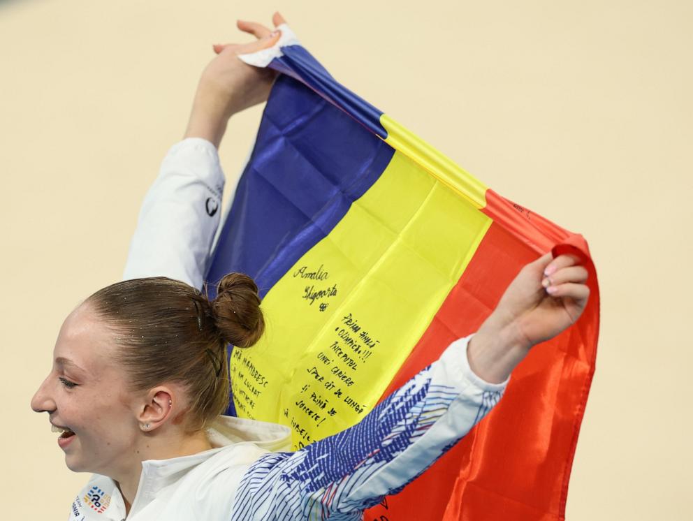 PHOTO: Ana Barbosu of Romania celebrates as she thinks she just won the bronze medal in the Artistic Gymnastics Women's Floor Exercise final at the Paris 2024 Olympic Games in Paris seconds later to find out the reclamation by Jordan Chiles.