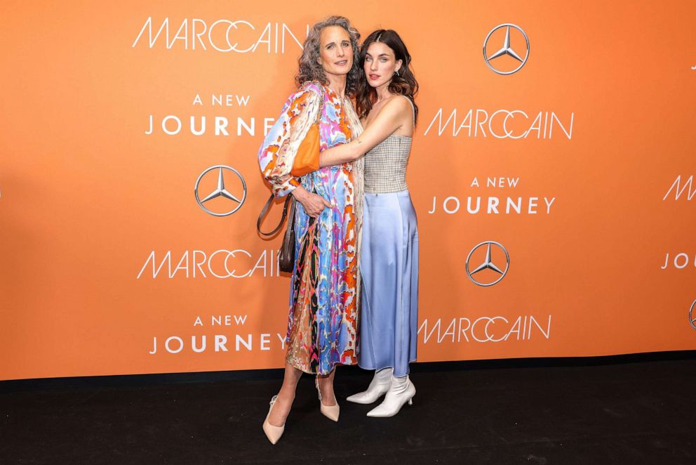 PHOTO: Andie MacDowell and her daughter, singer Rainie Qualley, arrive at the show for the Mark Caine label during the offsite fashion show at Berlin's former Tempelhof Airport on January 19, 2023.