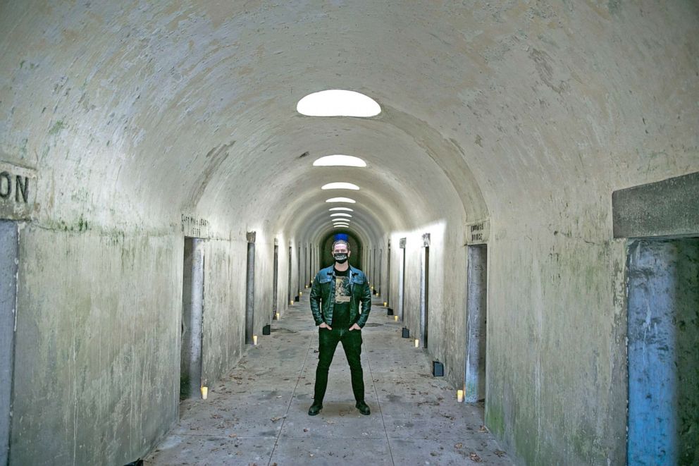 PHOTO: Andrew Ousley, the founder of Death of Classical, is pictured in Green-Wood Cemetery's catacombs.