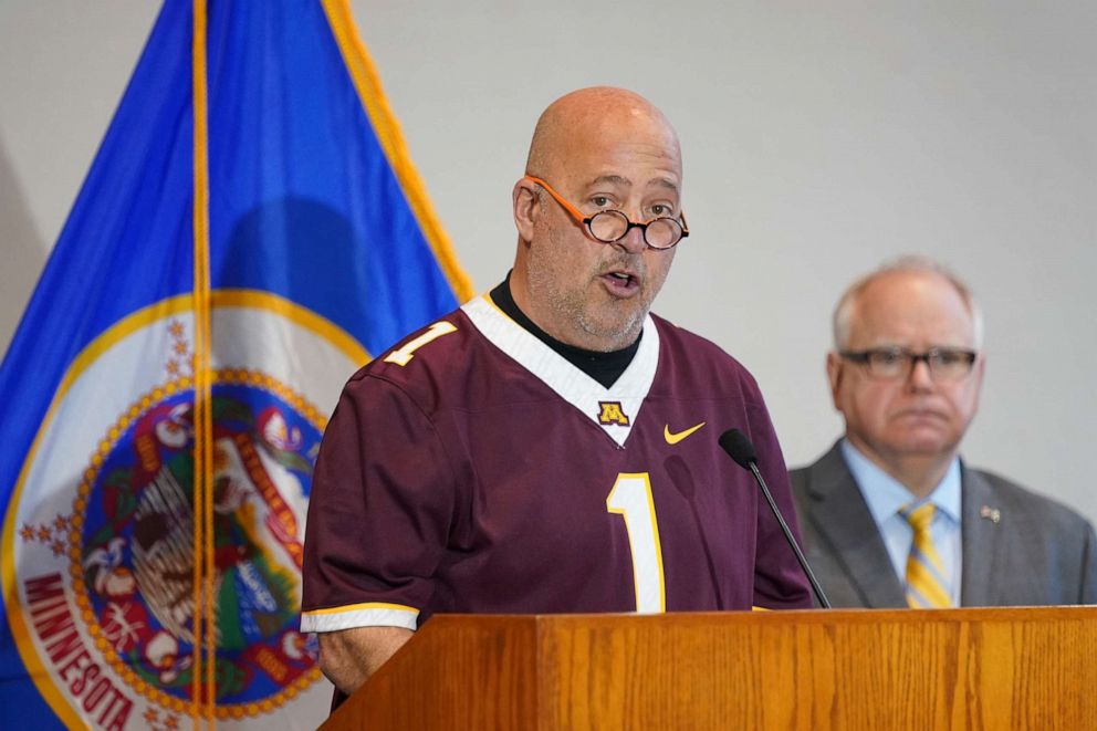 PHOTO: In this March 16, 2020, file photo, restaurant owner Andrew Zimmern, along with Minnesota Gov. Tim Walz speaks during a news conference in St. Paul, Minn.