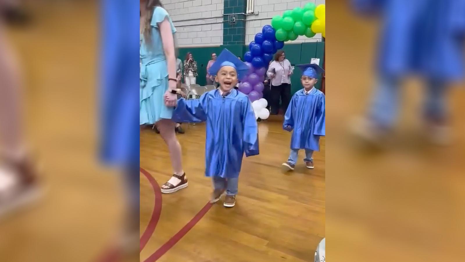 PHOTO: Twins Angel and AJ excitedly shout out their family members at their preschool graduation ceremony in Ridgefield Park, N.J.