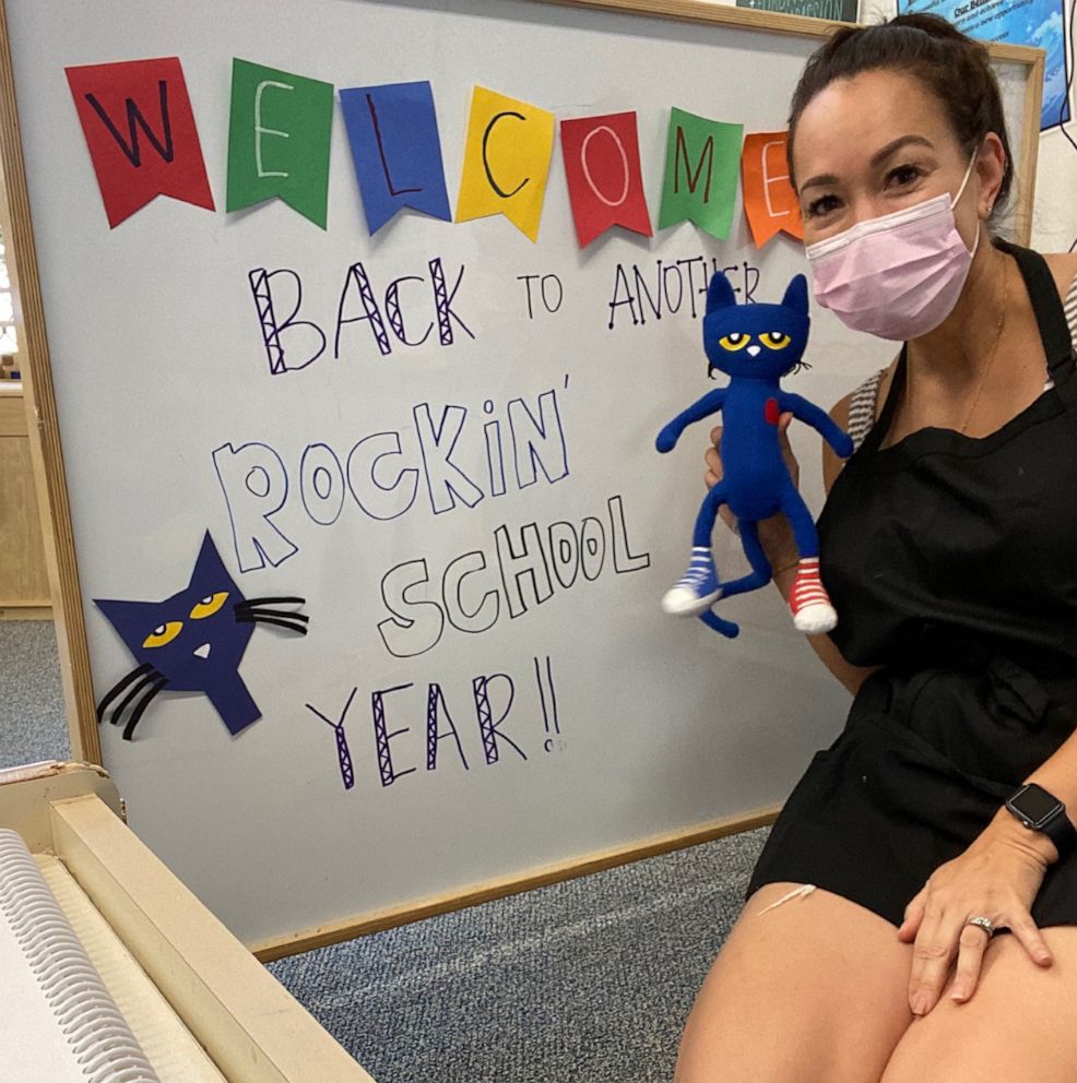 PHOTO: Angela Rivero, an ECSE teacher in Hawaii, poses in her classroom while wearing a face mask.