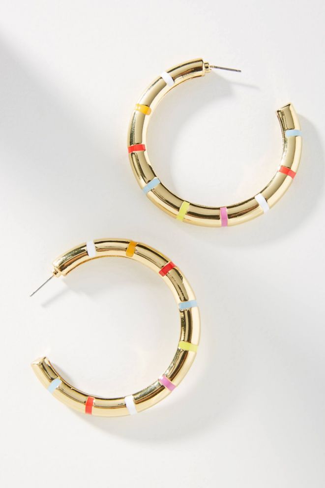 PHOTO: Nod to the trend with this colorful hoop that can be paired with both office and weekend looks. Style Hint: Pull your hair back to accentuate the bright stripes.