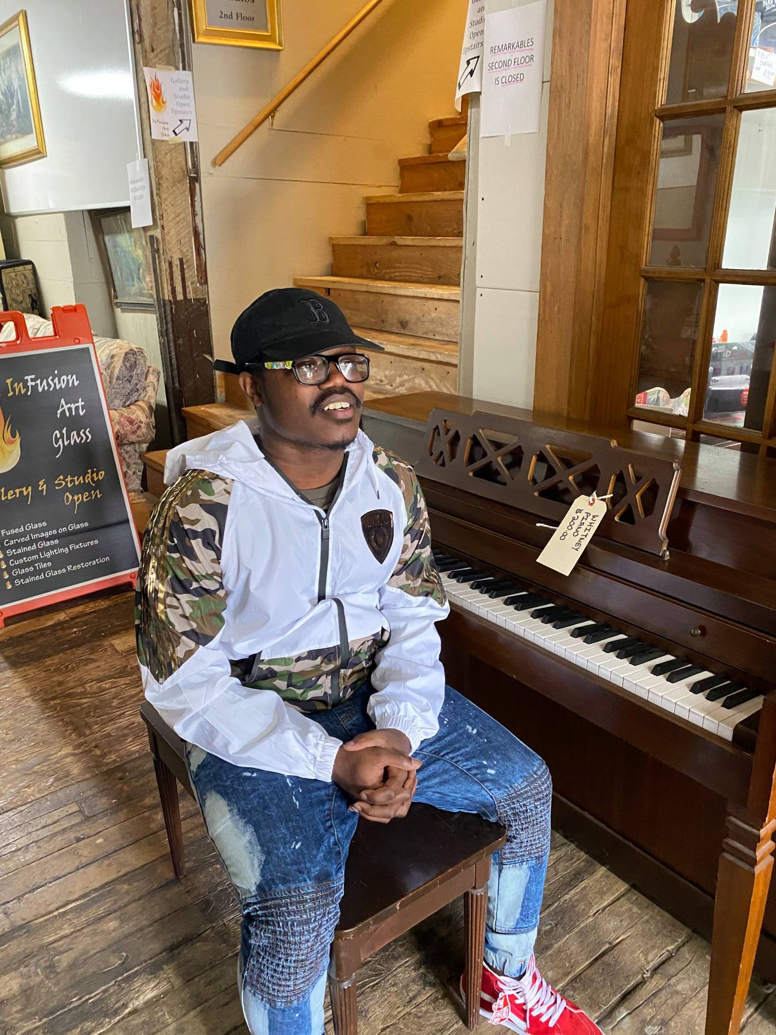 PHOTO: On July 11, 23-year-old John Thomas Archer asked employees at ReMARKable Cleanouts in Norwood, Massachusetts, permission to play a piano that was out on display.