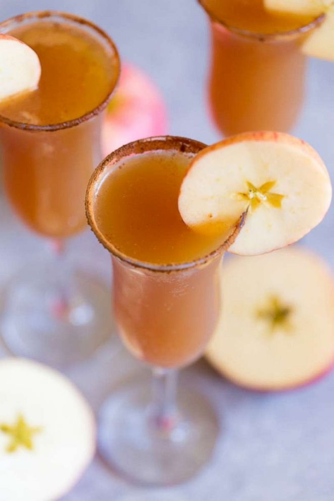 PHOTO: Rim the glasses of your apple cider mimosas in cinnamon sugar and garnish with apple slices.