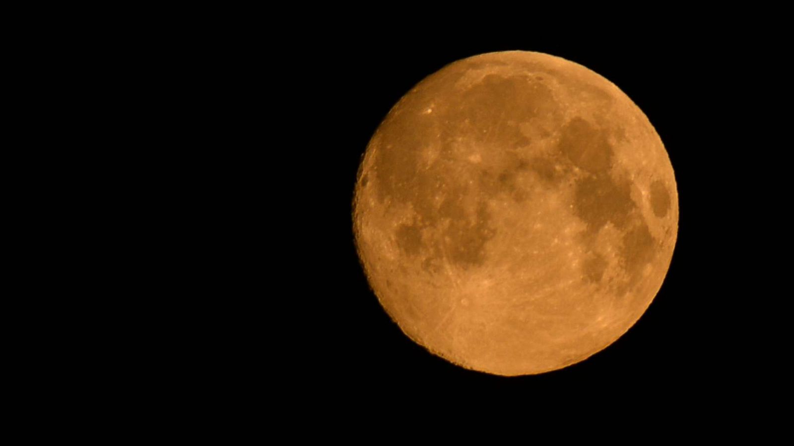 PHOTO: A view of the pink moon, or April full moon, the closest supermoon of the year, seen over Krakow, Poland, April 7, 2020.