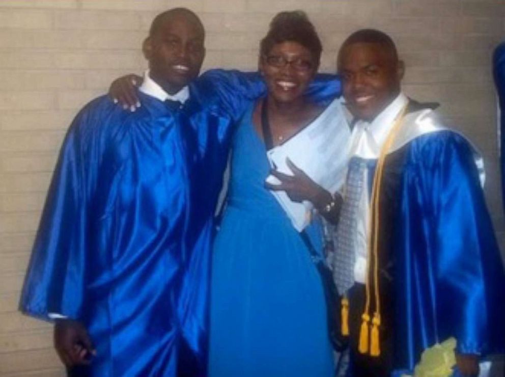 PHOTO: Ahmaud Arbery, left, and his mother Wanda Cooper-Jones attend a graduation.