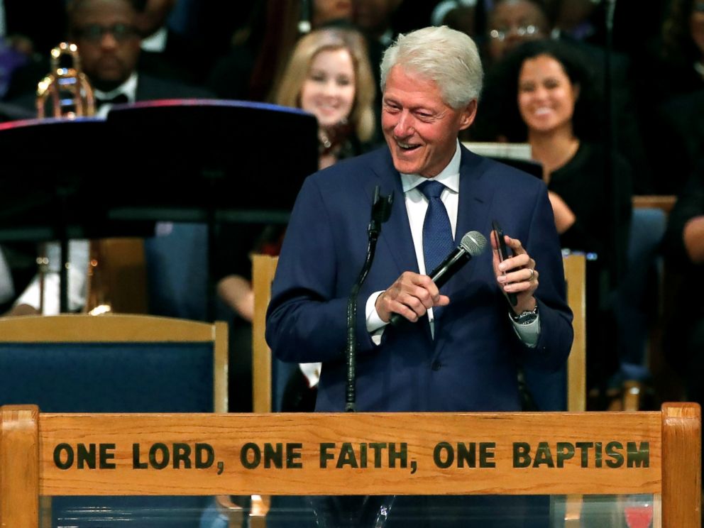 PHOTO: Former President Bill Clinton plays Aretha Franklin music on his mobile phone while speaking at the funeral service for the late singer at the Greater Grace Temple in Detroit, Aug. 31, 2018.