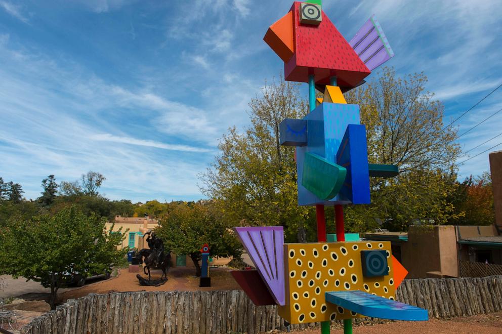 PHOTO: In this Oct. 18, 2017, file photo, colorful art statues are shown along Canyon Road in Santa Fe, New Mexico. 
