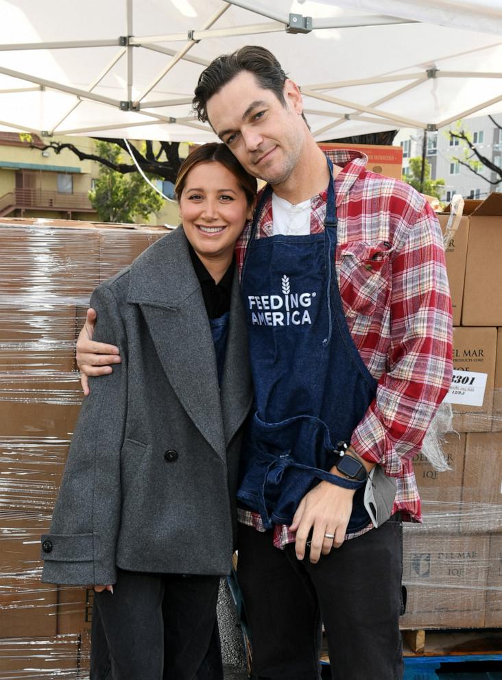 PHOTO: In this Dec. 22, 2023, file photo, Ashley Tisdale and Christopher French volunteer in North Hills, Calif.