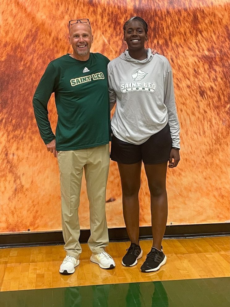 PHOTO: Saint Leo University men's basketball coach Lance Randall poses with one of his assistant coaches, Ashley Webster.