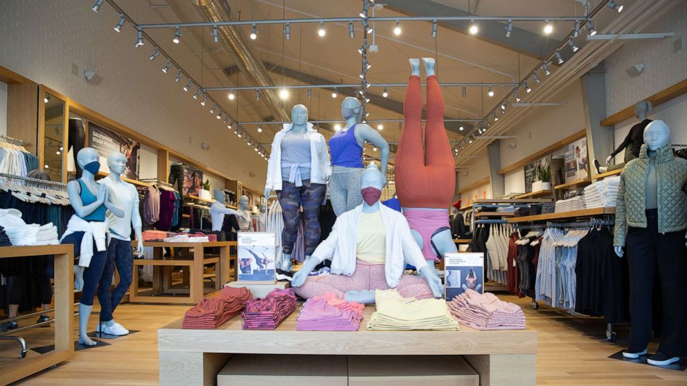 A handout image shows the inside of an Athleta store.