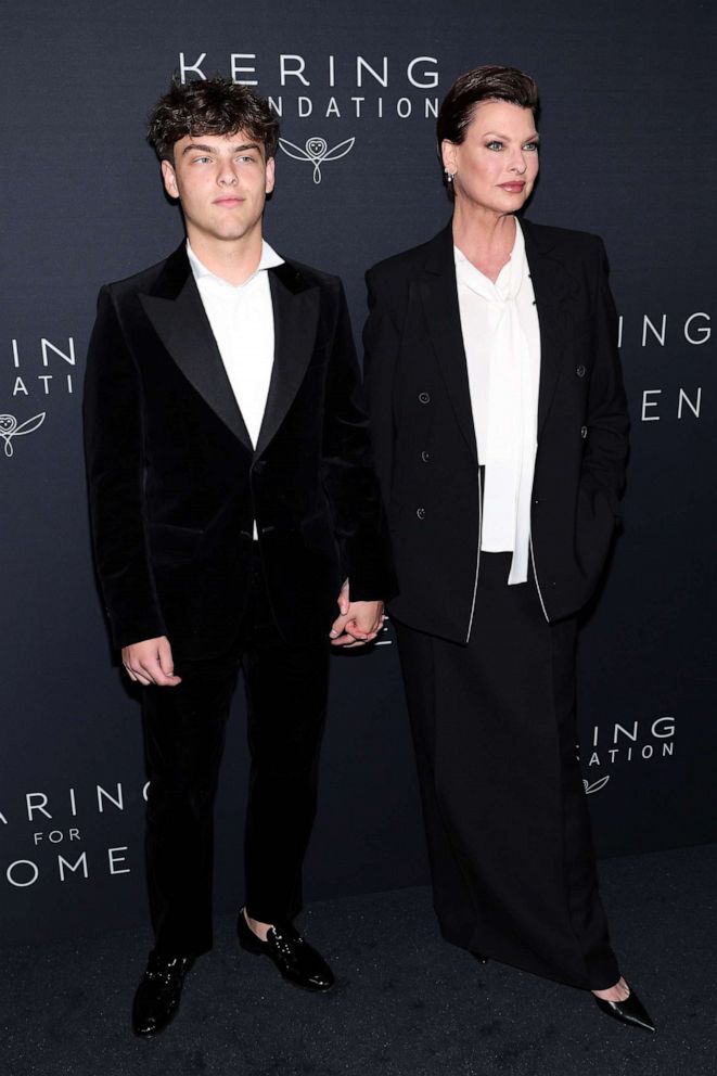 Linda Evangelista and son Augustin twin in matching suits at 2nd