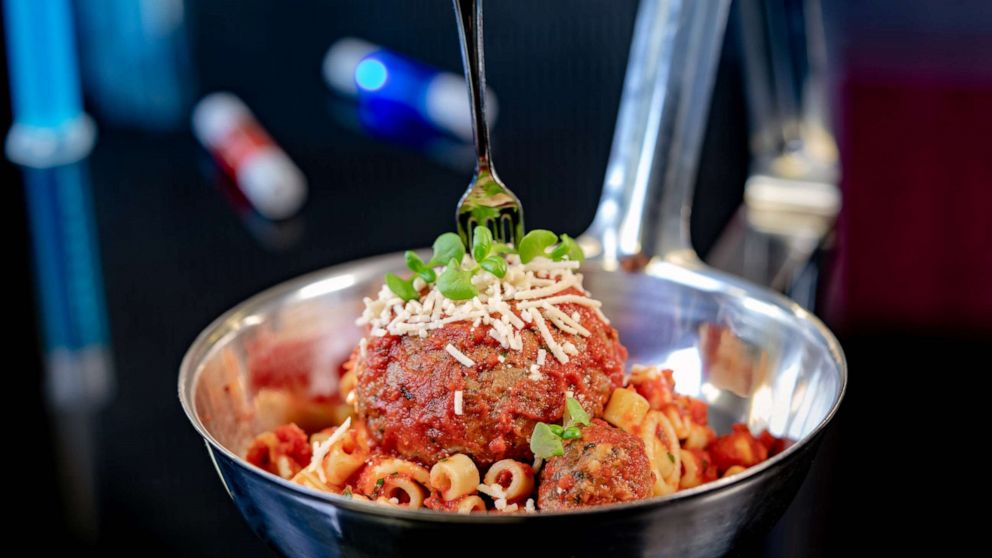 PHOTO: Pym Test Kitchen in Avengers Campus inside Disney California Adventure Park in Anaheim features a pasta dish featuring plant-based large and micro vegan meat-balls, served in a super-sized spoon with a tiny fork. 