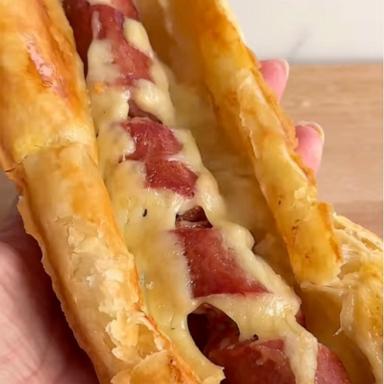 PHOTO: A puff pastry hot dog with cheese.