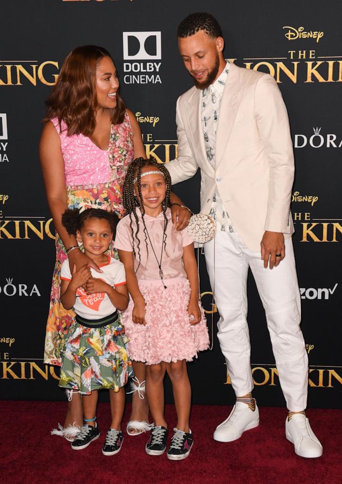 PHOTO: Steph Curry, his wife Ayesha Curry and daughters Ryan (L) and Riley (R) arrive for the world premiere of Disney's "The Lion King" at the Dolby theatre on July 9, 2019 in Hollywood.