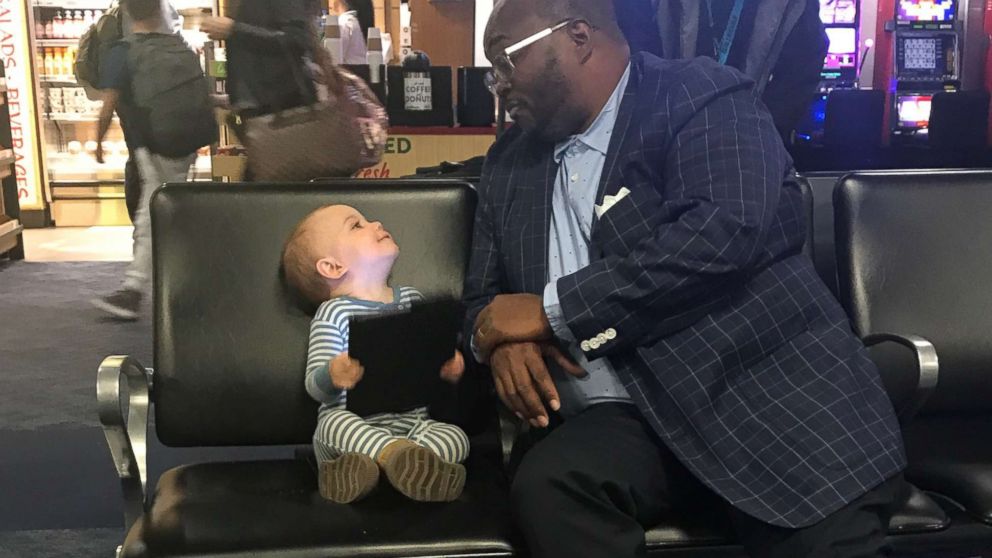 VIDEO: Toddler, businessman become friends at airport