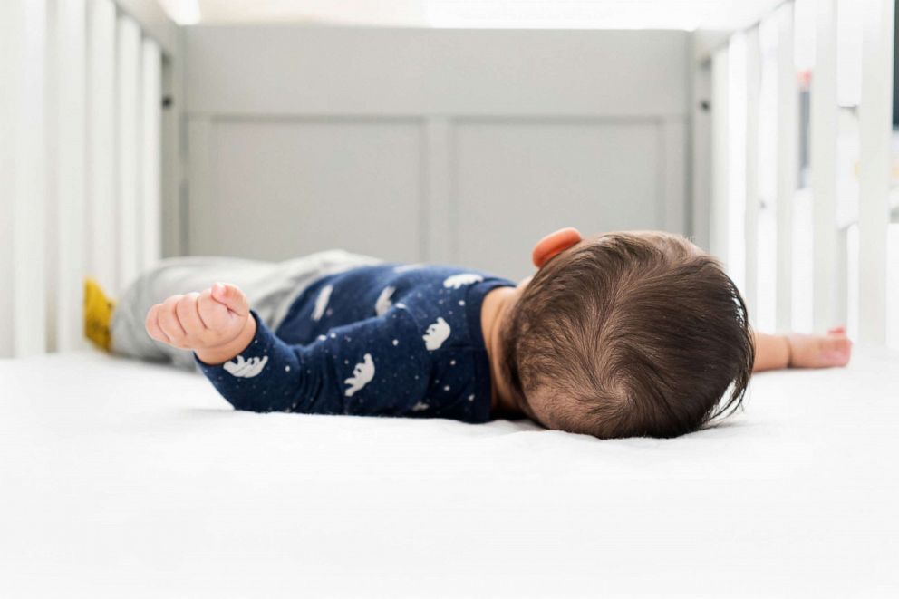 PHOTO: A baby lies in a crib.