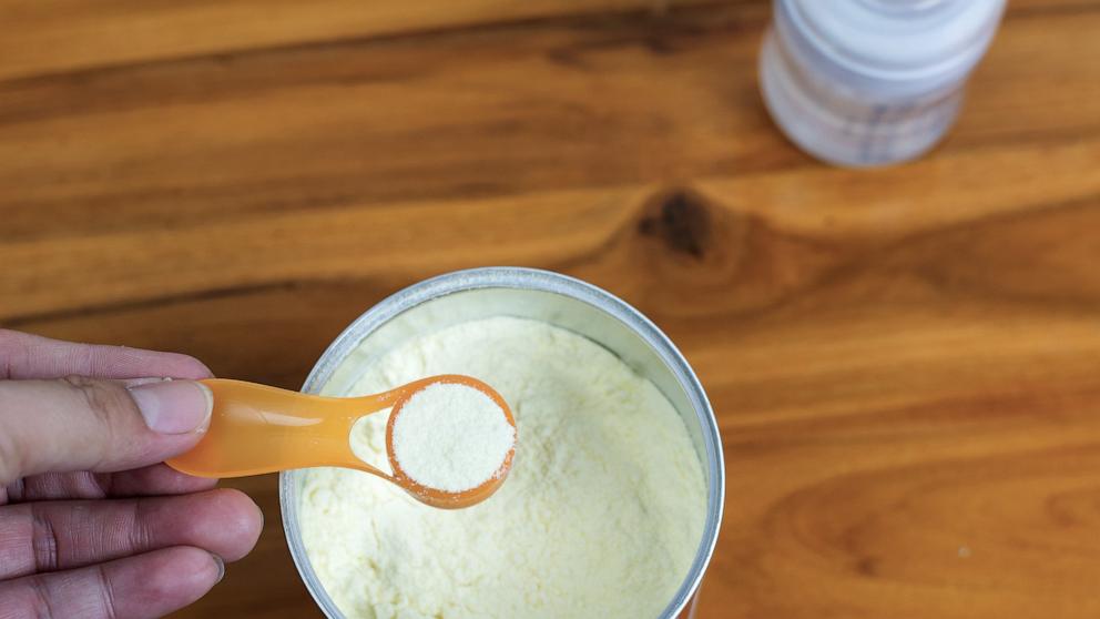 PHOTO: Stock photo of baby formula powder being prepared.