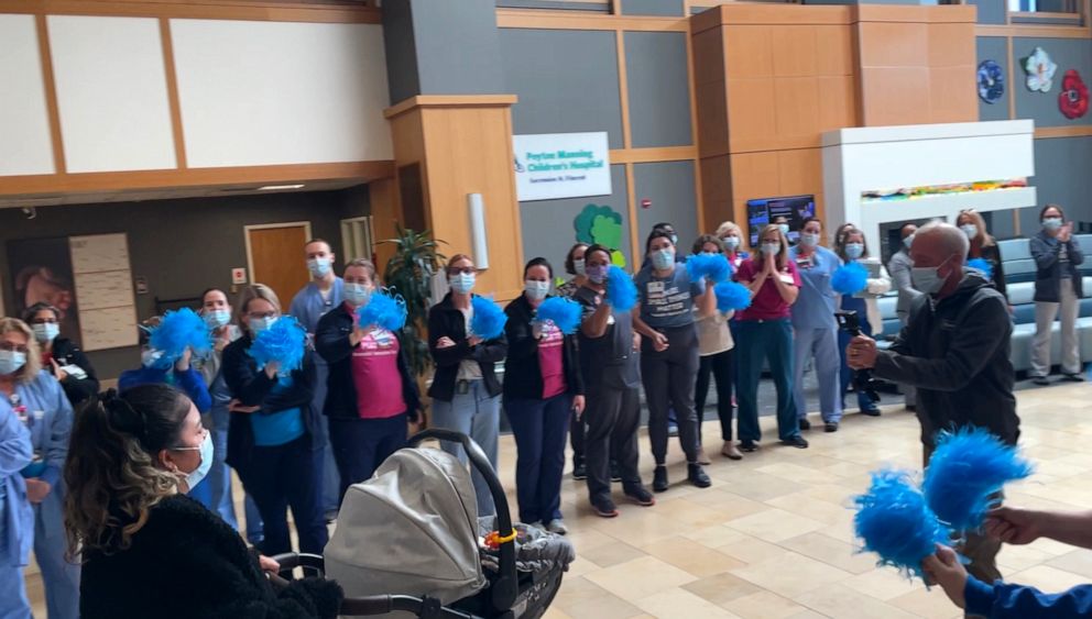 PHOTO: Staff at Peyton Manning Children's Hospital lined the hallway to send off Giorgio with his mom Estefania Alvarado on his discharge date.